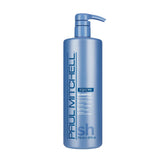 Paul Mitchell Bond Rx Shampoo bottle on shelf offers gentle cleansing for fragile hair.