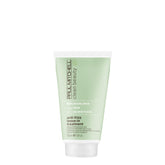 Paul Mitchell Clean Beauty Anti-Frizz Leave-In bottle shows frizz control in action.