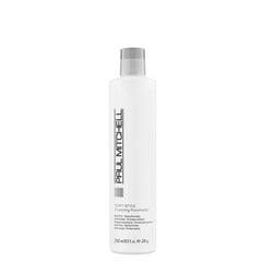 Paul Mitchell Foaming Pomade bottle shows light hold and shine for waves.