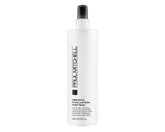 Paul Mitchell Freeze and Shine hairspray bottle closeup shows powerful hold and high shine for coarse hair.