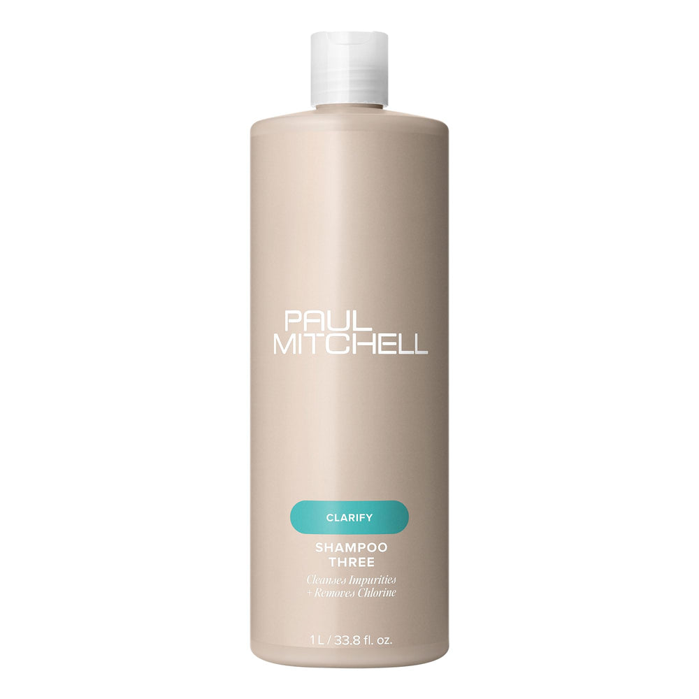 Paul Mitchell Shampoo Three bottle close-up demonstrates clarifying cleanse for swimmer-treated hair.