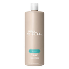 Paul Mitchell Shampoo Three bottle close-up demonstrates clarifying cleanse for swimmer-treated hair.