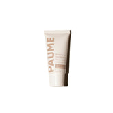 PAUME Renewing Hand Serum bottle close-up showing hydrating formula for dry hands.