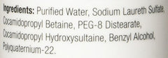 Person and Covey DHS Clear Shampoo packaging back conveys product origin and daily care.