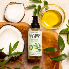 PHARM TO TABLE Tea Tree Hair Oil being applied to scalp for soothing relief.