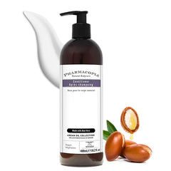 Pharmacopia Hotel Argan Oil Conditioner bottle on bathroom shelf delivers hydrated hair.