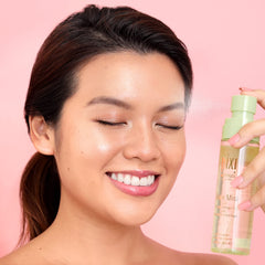 Pixi Beauty Glow Mist being sprayed on the face to refresh makeup and hydrate.