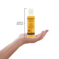 Plantlife Patchouli Body Oil used during a massage for soothing aroma.