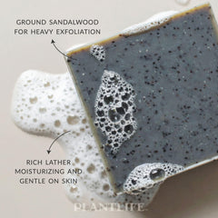 Plantlife Sandalwood Bar Soap being held shows compact 4oz bar for daily use.