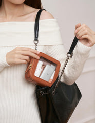 Popvibe transparent cosmetic bag close-up showcases durable easy-to-clean faux leather finish.