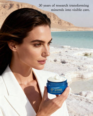 Premier Dead Sea aromatic body butter application on hands demonstrates quick-absorbing hydration.