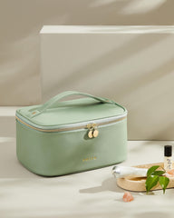Prite makeup bag green vegan-leather shell provides durable waterproof protection.
