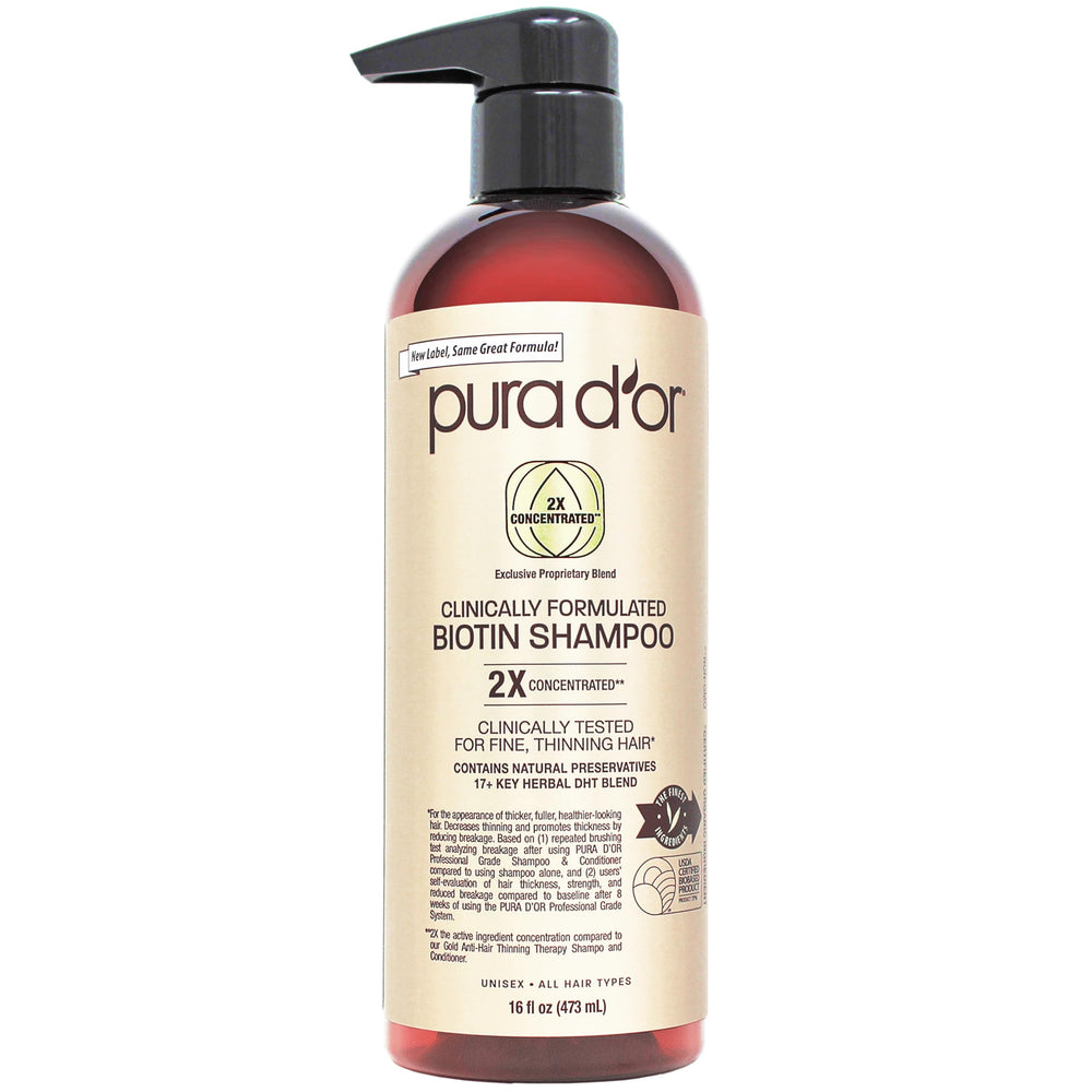 PURA D'OR Biotin Shampoo bottle with organic formula for thicker-looking, healthier hair.