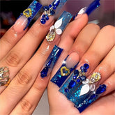 QQPPOLIU Royal Blue press-on nails with glossy coffin tips for party-ready style.