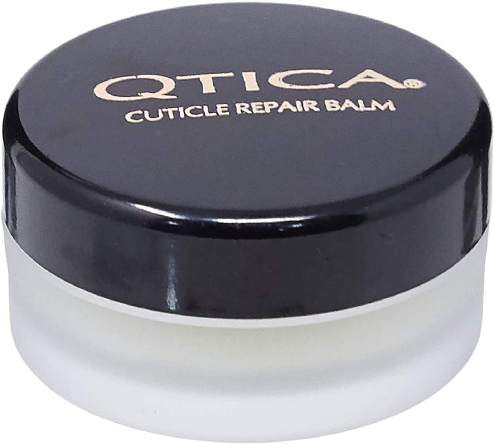 QTICA Intense Cuticle Repair Balm bottle closeup for deep hydration of dry cuticles.