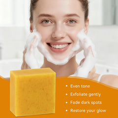 QualiLife Kojic turmeric soap bar on wooden dish with natural lighting