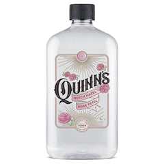 Quinn's Alcohol Free Witch Hazel bottle on vanity with rose scent for gentle cleansing.