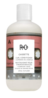 R+Co Cassette bottle pump demonstrates moisturizing curl definition for daily care