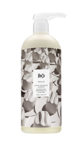 R+Co Dallas thickening shampoo bottle showcases premium vegan formula for fuller hair.
