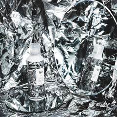 R+Co Foil Frizz Spray closeup highlights lightweight formula and flyaway reduction