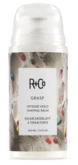 R+Co Grasp balm packaging highlights premium hold for sleek styling without crunch.