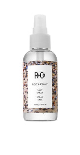 R+Co Rockaway Salt Spray bottle close-up for texture and beachy volume.