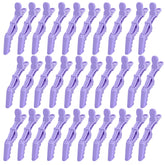 Rabetly alligator hair clip with wide teeth in purple for secure sectioning and precise styling.