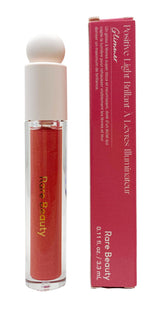 Rare Beauty Glimmer lip gloss bottle showing pearlescent rose-gold shine for hydrated lips.