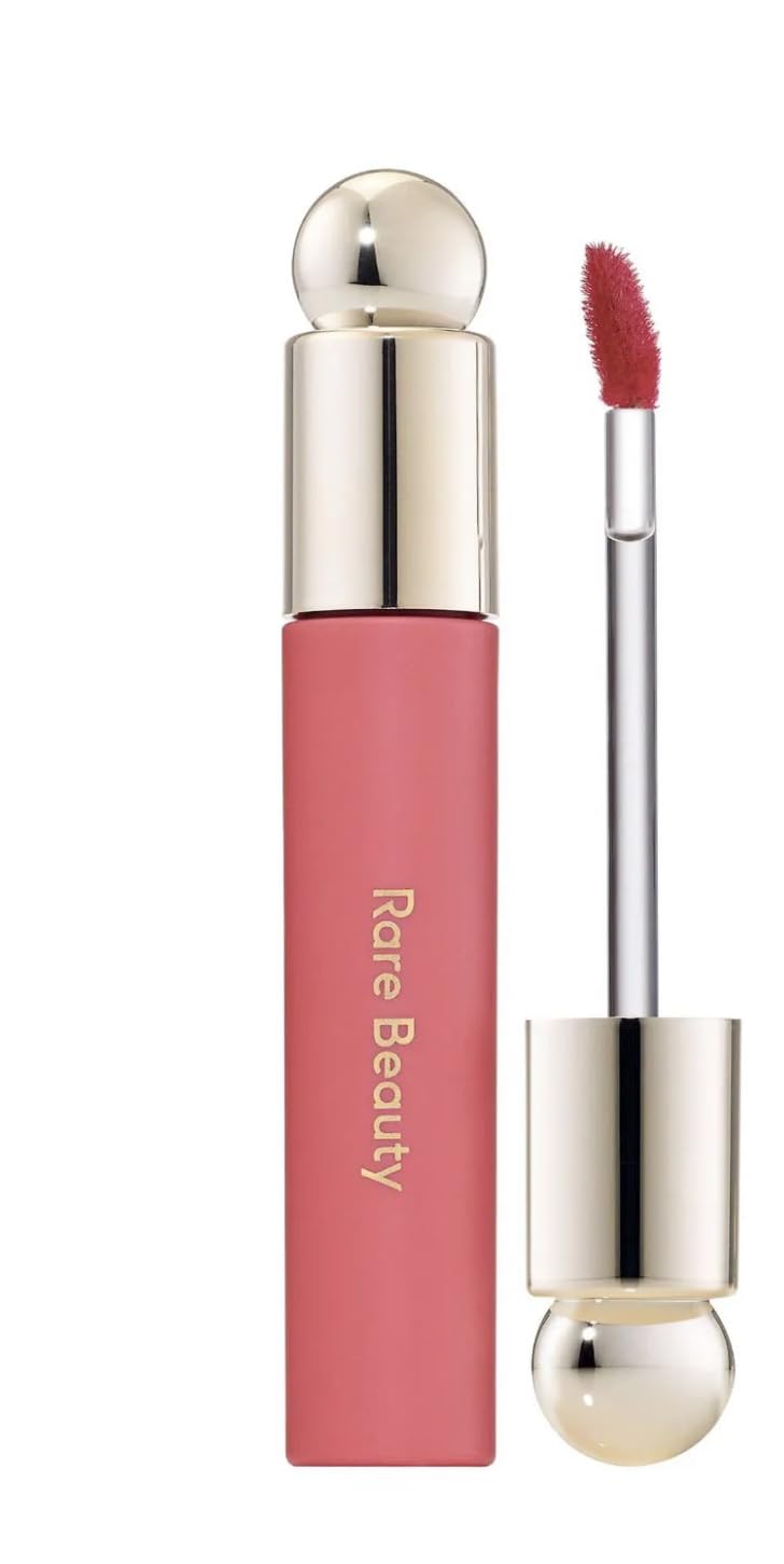 Rare Beauty Soft Pinch Tinted Lip Oil Happy delivers a comfortable glossy tint for all-day wear.