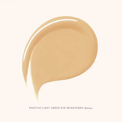 Rare Beauty under-eye brightener application demonstrates smooth glide for quick under-eye brightening