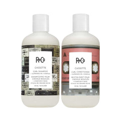 R+Co Cassette Curl Shampoo bottle shows defined curls and glossy lather.