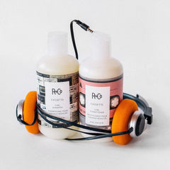 R+Co Cassette Curl Shampoo lather close-up emphasizing cleansing that preserves curls.