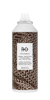 R+Co Chainmail heat protection spray bottle providing 450°F shield for smoother styling