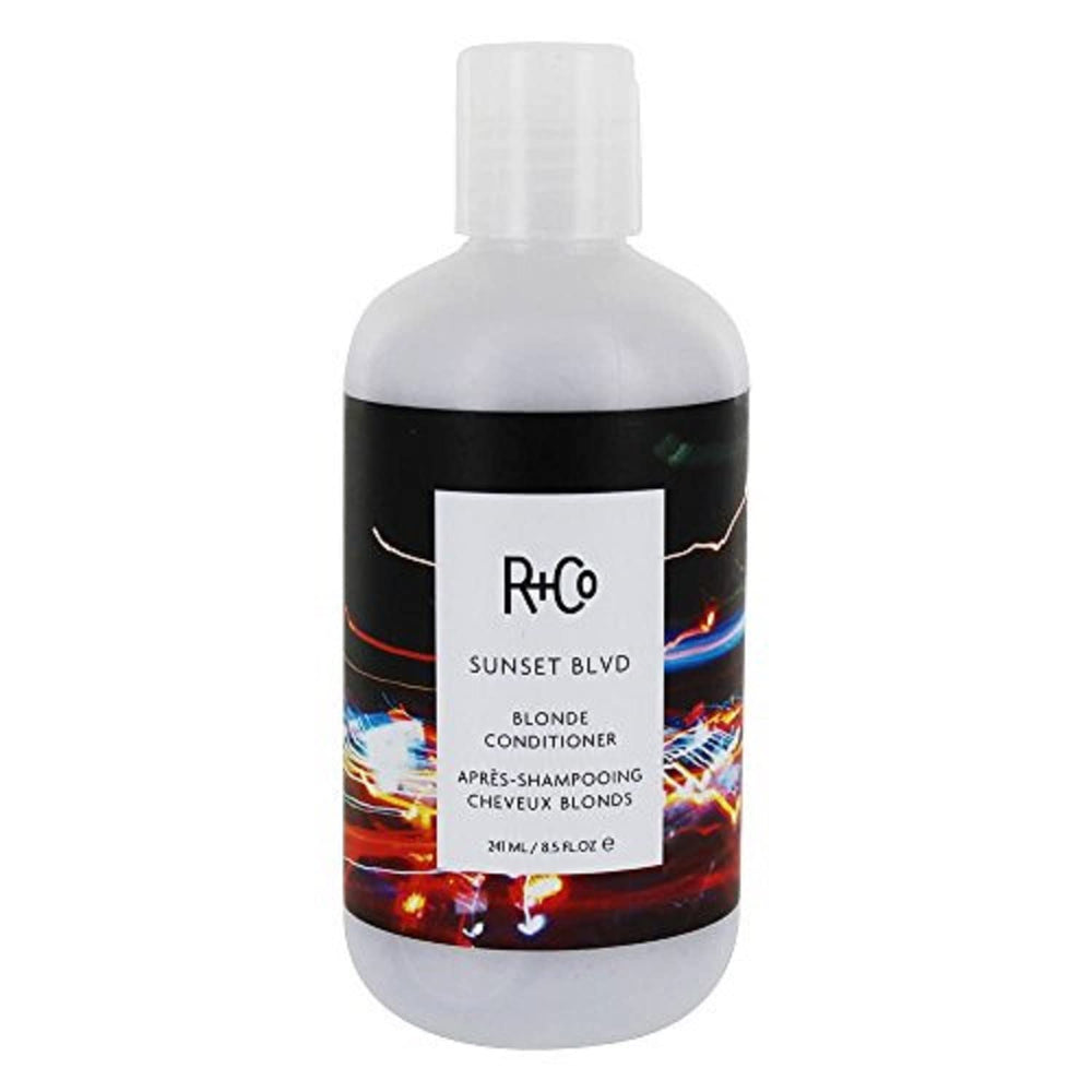 R+Co Sunset Blvd Blonde Conditioner bottle on shelf for daily brightness and hydration.