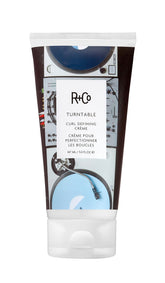 R+Co Turntable curl defining creme jar close-up showing creamy texture for defined, bouncy curls.