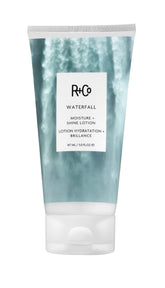 R+Co Waterfall Lotion bottle showcasing hydration for shiny hair.