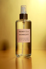 Rebecca Minkoff Blush base notes cedarwood close-up evokes warm, lasting scent.