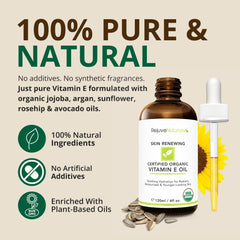 RejuveNaturals Vitamin E Oil dropper in use for targeted facial nourishment and glow.