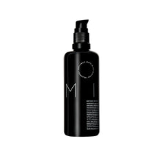 REVERIE Natural Milk Leave-In bottle pour for frizz control and lightweight hydration.