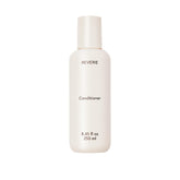 REVERIE natural nourishing conditioner bottle shows color-safe hydration for glossy, manageable hair.