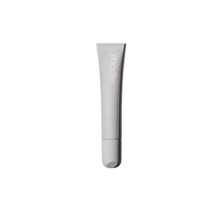 Rhode Salted Carmel Lip Treatment bottle closeup emphasizes glossy hydration.