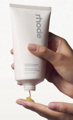 Rhode Pineapple Refresh lathering balm texture demonstrates spa-like cleansing during application.