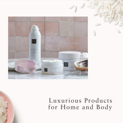 RITUALS Ritual of Sakura body scrub bottle on desk emphasizes unisex-friendly design.