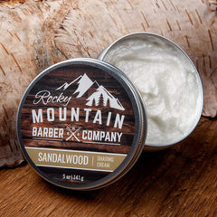 Rocky Mountain Barber Co thick-lather shaving cream being applied by hand.