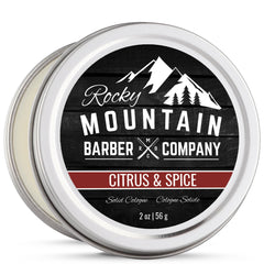 Rocky Mountain Barber Solid Cologne tin closeup highlights compact packaging for travel.