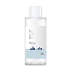 ROUND LAB Dokdo toner bottle front offers gentle exfoliation and hydration in a light, watery formula.