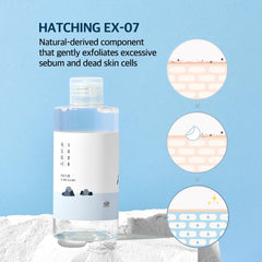 ROUND LAB Dokdo toner on cotton pad shows gentle exfoliation without irritation.