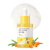 ROUND LAB Vita Niacinamide Dark Spot Serum bottle closeup highlights radiance-boosting formula for even skin tone.
