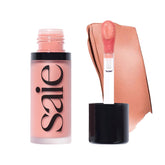 Saie Dew Liquid Blush application shows natural flush with buildable color.