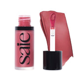 Saie Dew Liquid Blush applicator close-up showing creamy texture for easy blending.